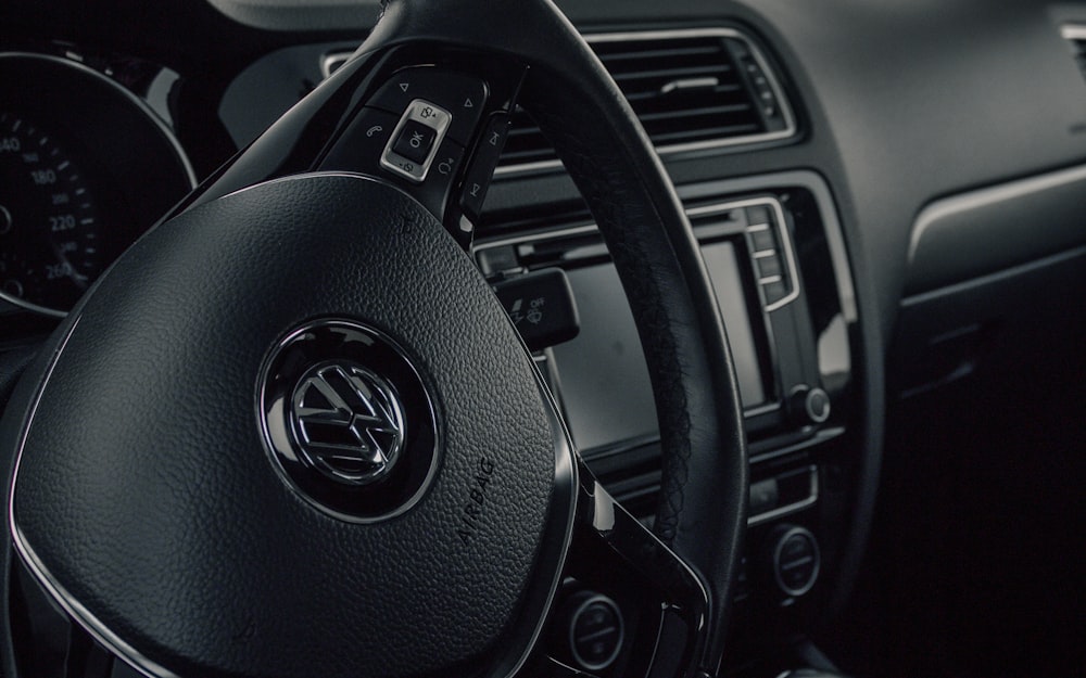 black and silver mercedes benz steering wheel