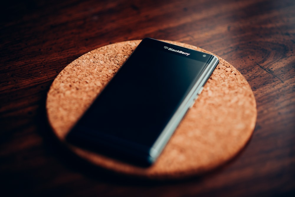 black sony xperia on brown wooden table
