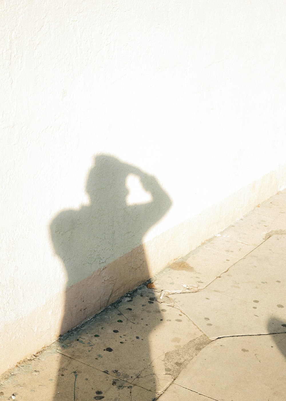 shadow of person on white wall