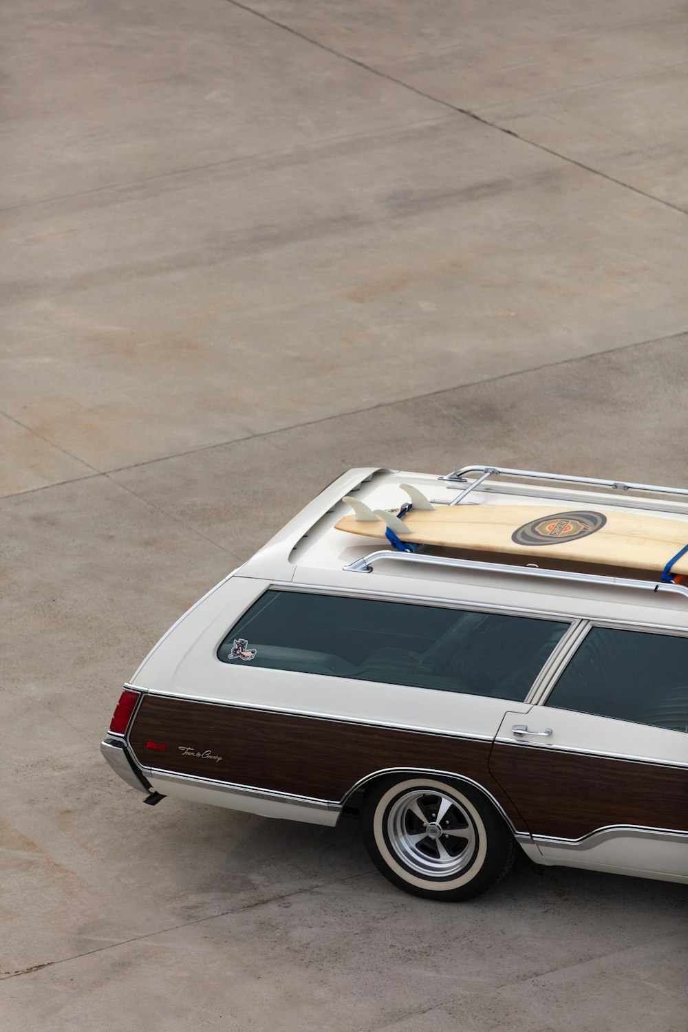 white and brown station wagon