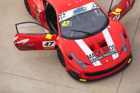 red and white ferrari sports car