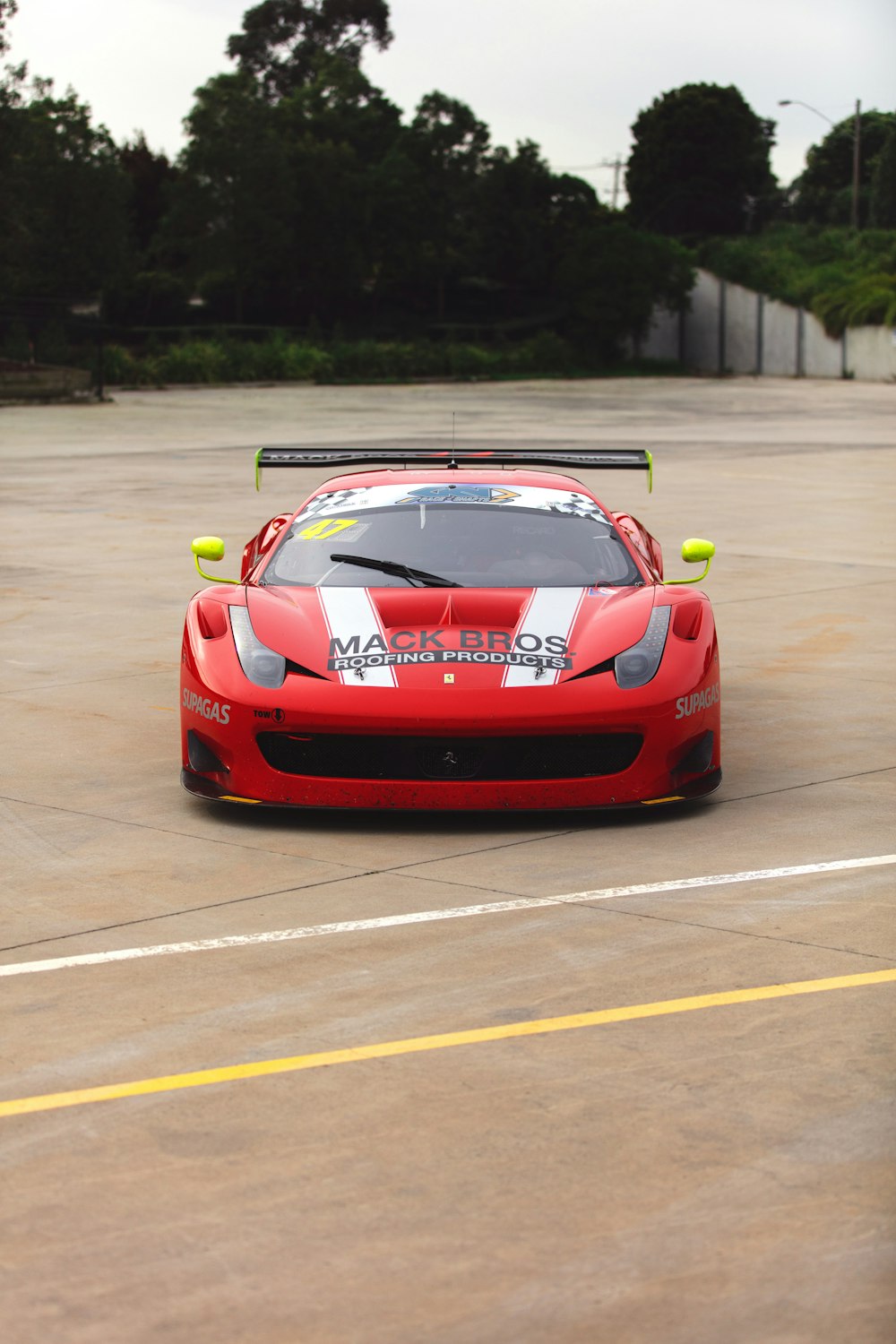 red ferrari 458 italia on track field