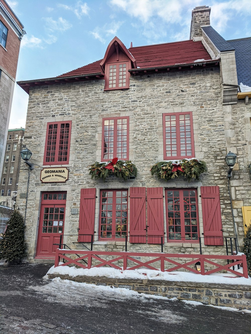 red wooden door on brown brick building