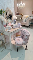 Elegant vanity stools arranged around a small dining table.