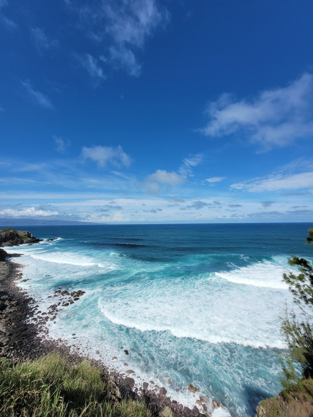 blue sea under blue sky during daytime