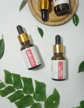 two white and red labeled bottles
