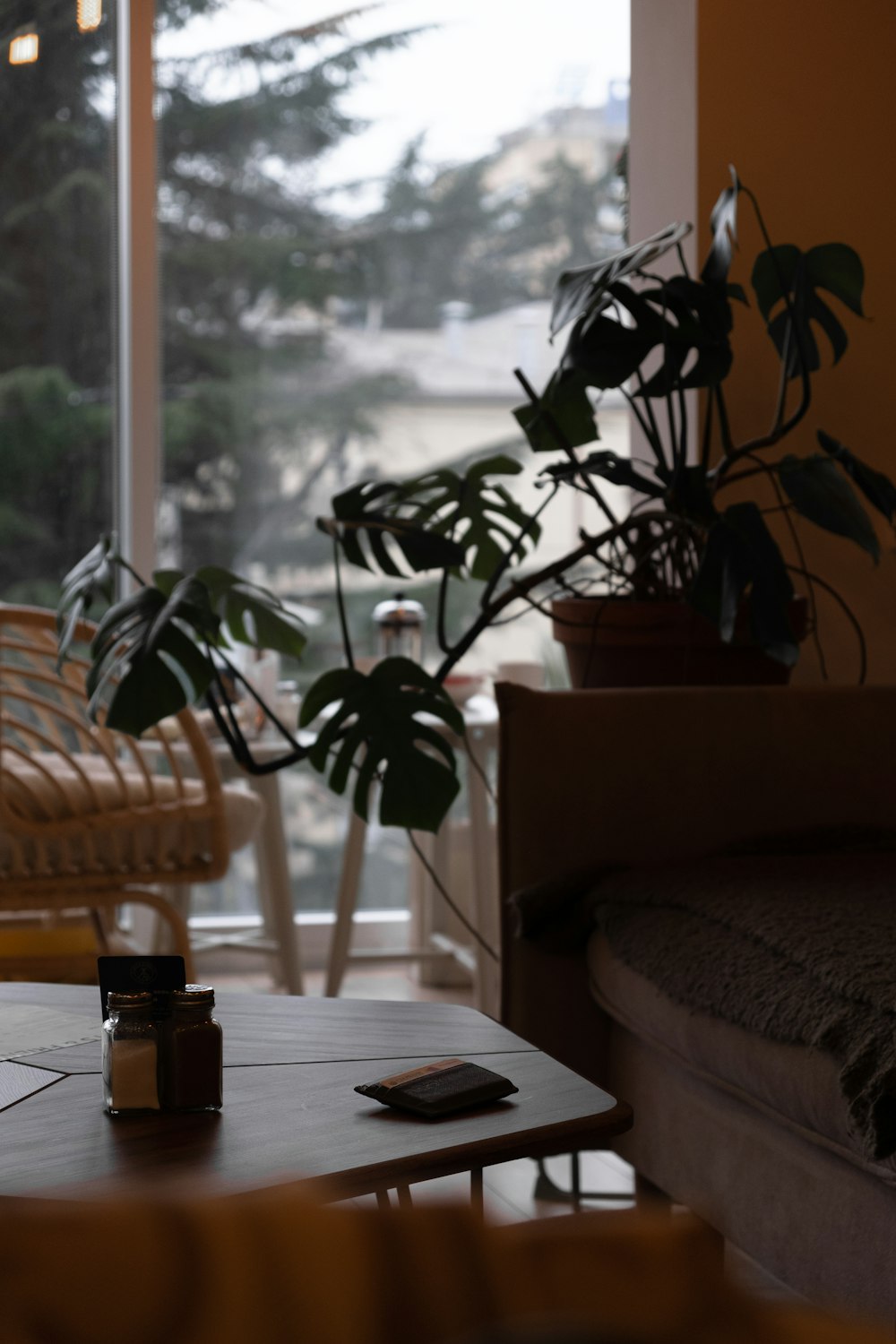 brown wooden table near window