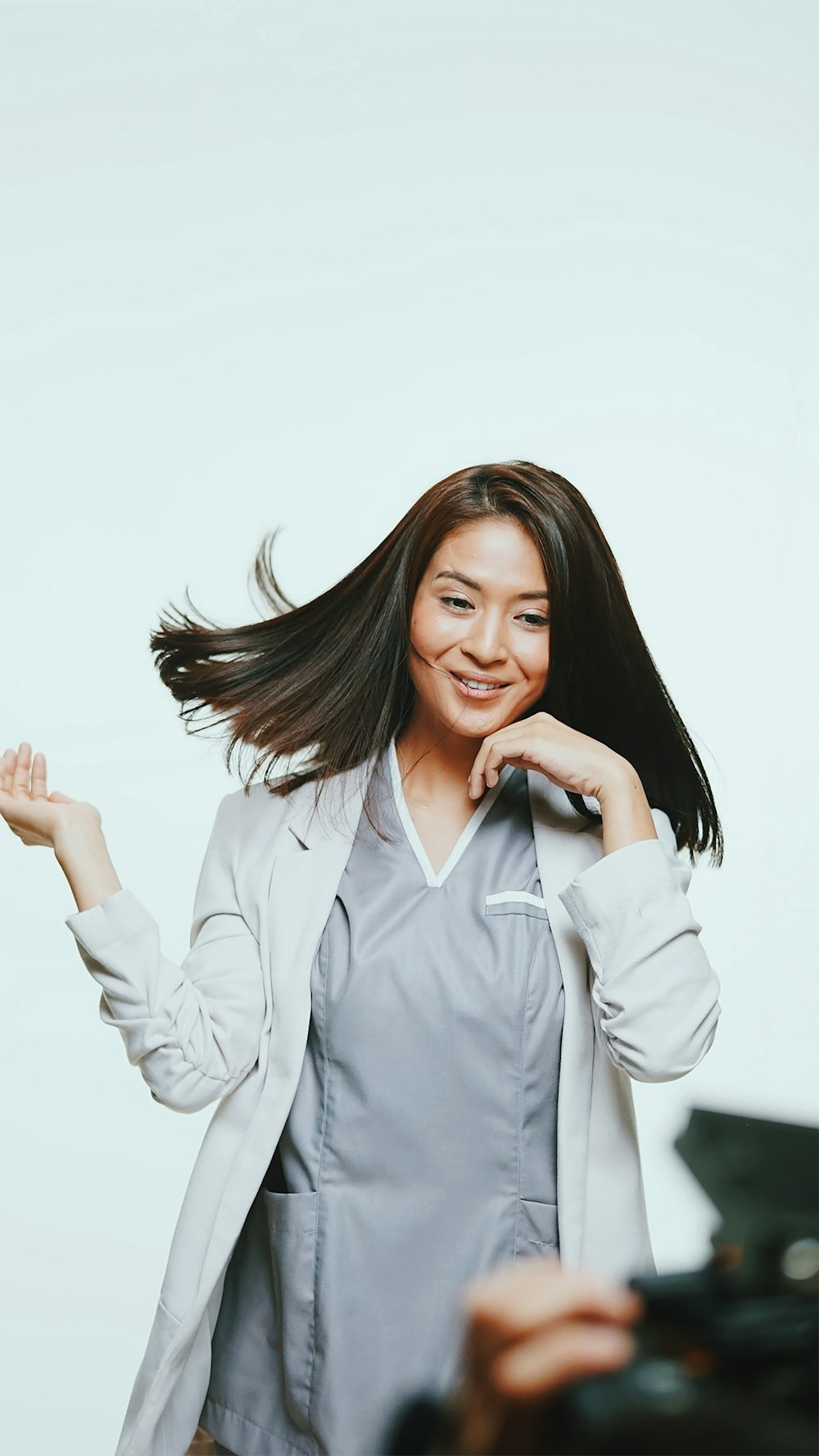 woman in white button up long sleeve shirt