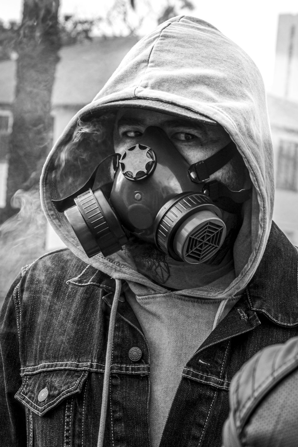 person wearing black gas mask