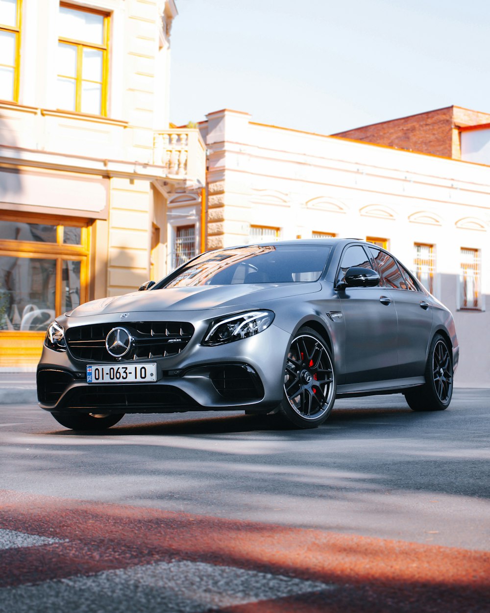 black mercedes benz coupe parked on street during daytime