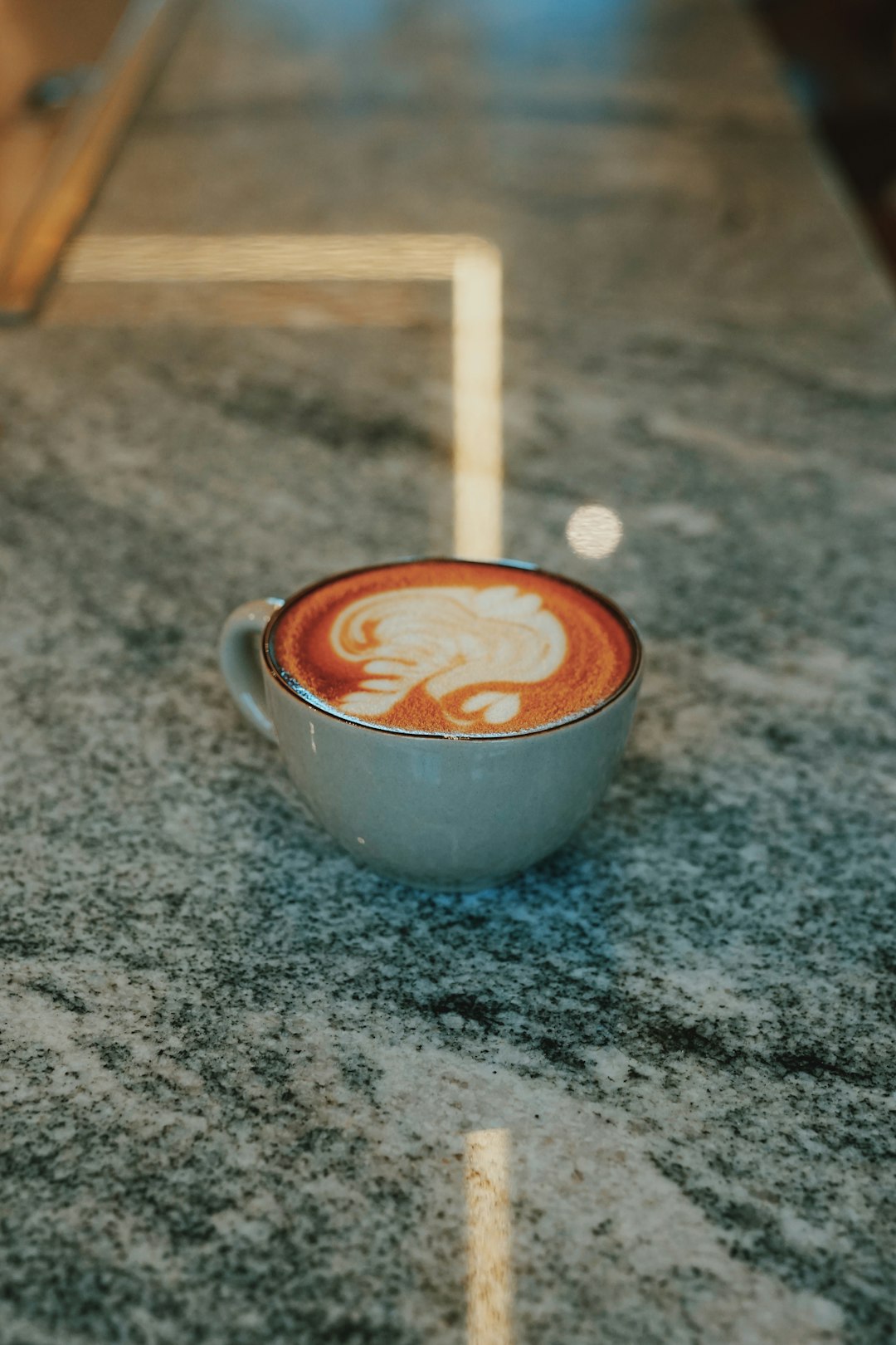 white ceramic cup with brown liquid