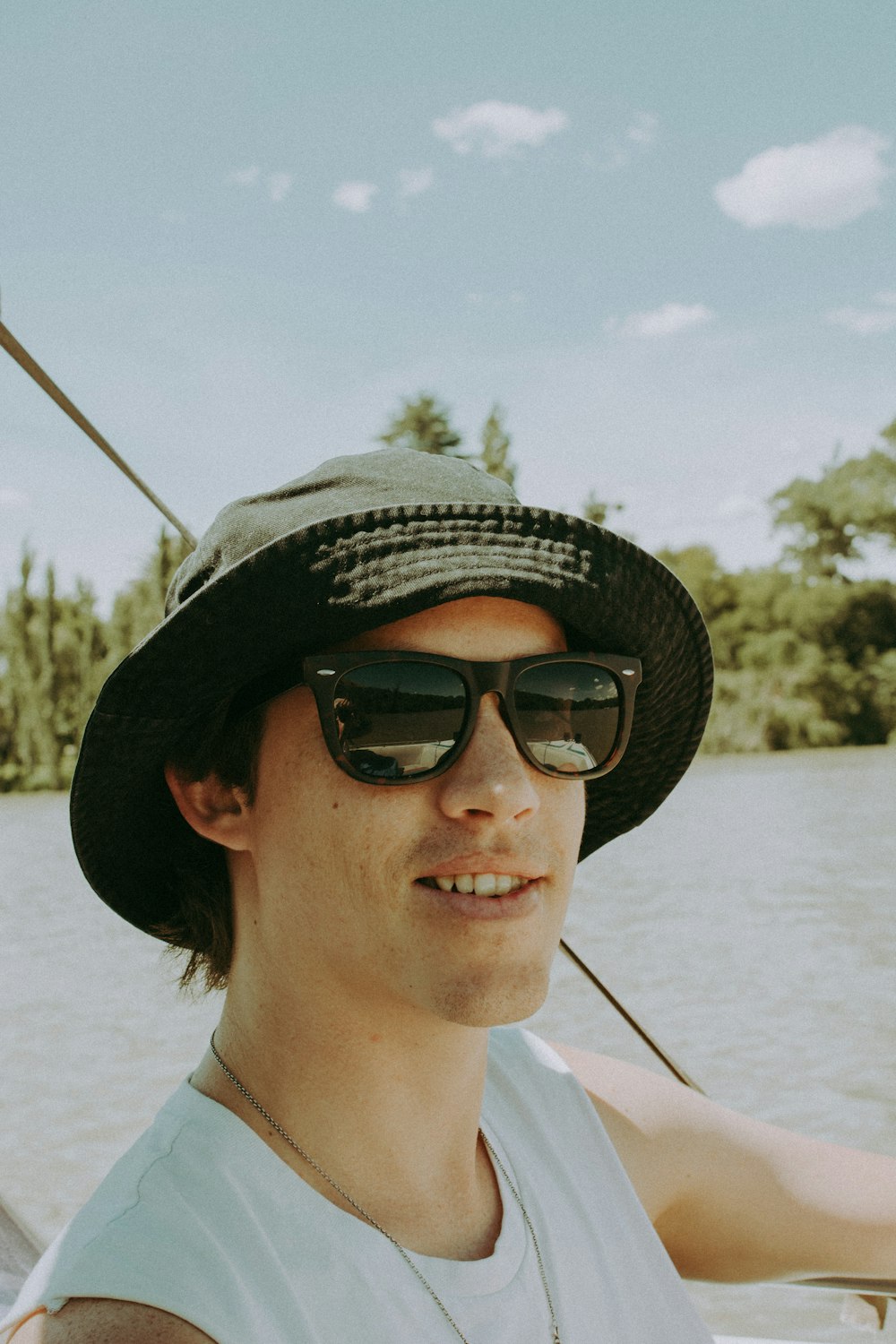 woman wearing black sunglasses and white knit cap