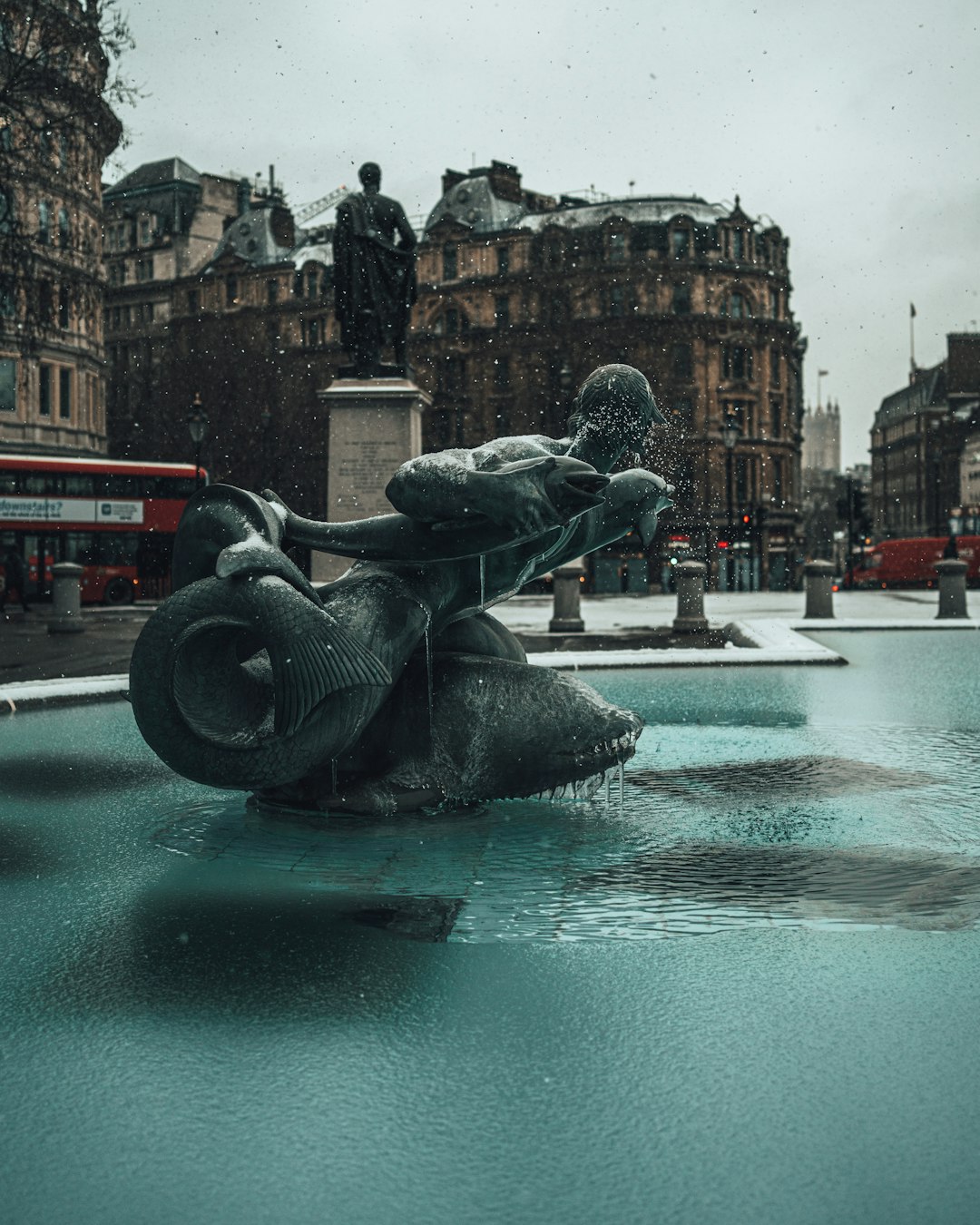 gray statue on water fountain