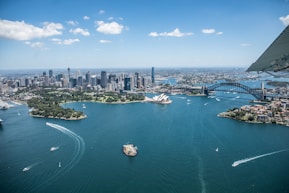 white and blue boat on body of water during daytime
