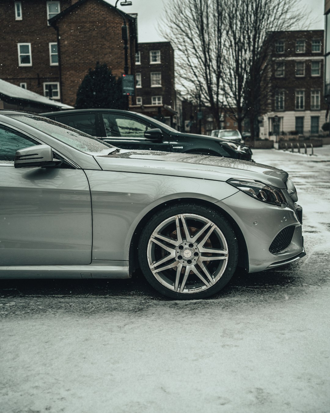 silver car on snow covered road during daytime