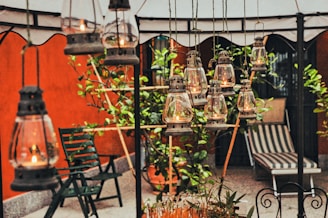 Variety of rental items such as chairs, arches, and lanterns displayed in soft, natural light.