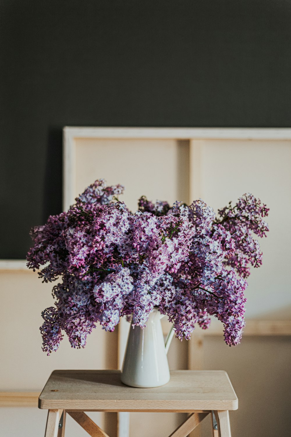 purple flowers on brown wooden table