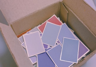 white and red square on brown cardboard box