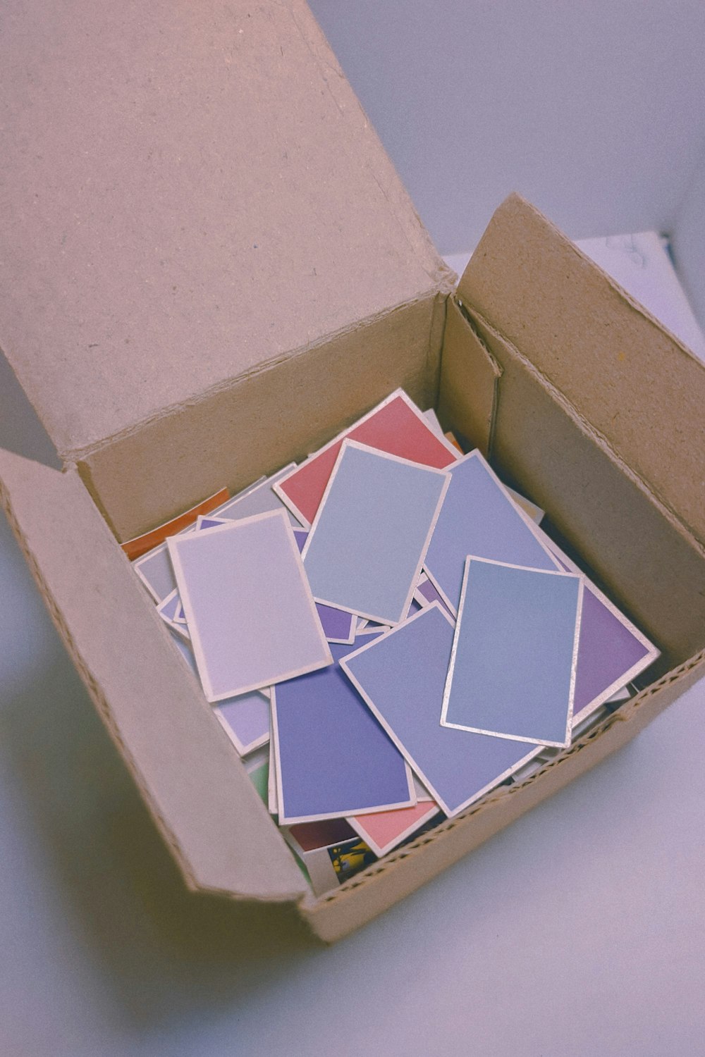 white and red square on brown cardboard box