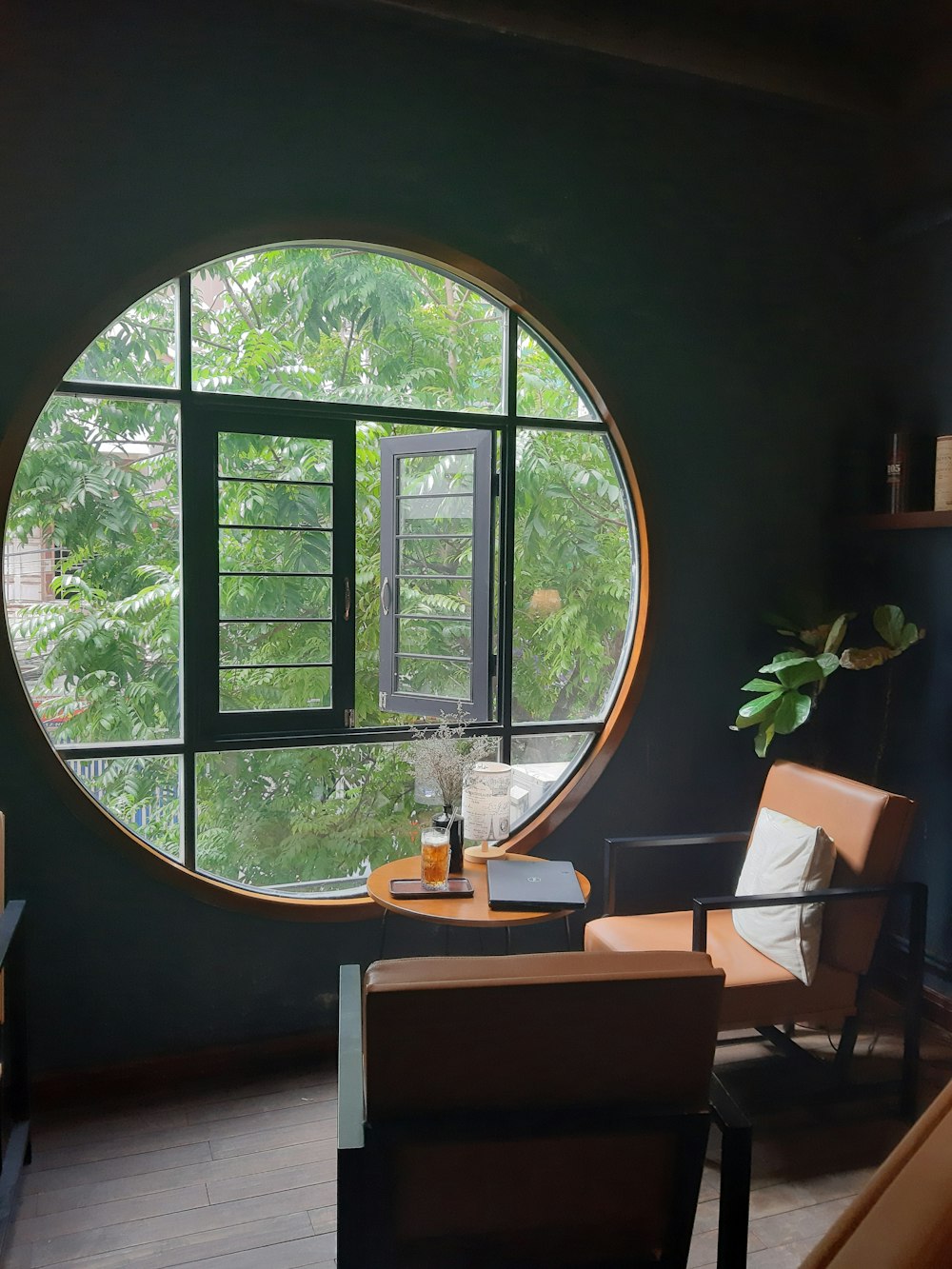 brown wooden table near window