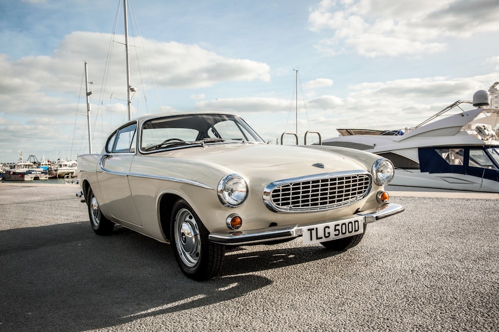 silver mercedes benz coupe on gray asphalt road during daytime