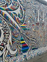 A lively street art mural filled with vivid colors.