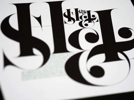 Close-up of a sleek, modern typeface specimen displayed on a minimalist white background.