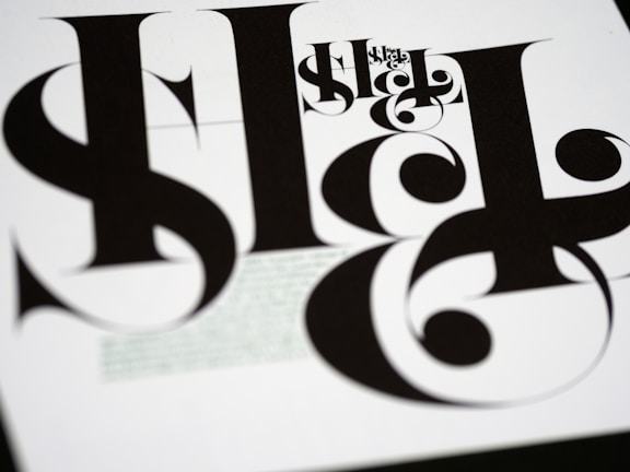 A sleek black and white graphic design poster showcasing modern typography.