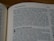 A close-up view of an open book displaying a page with text, focused on a section titled 'The History Books'. The text is printed in a serif font on an off-white page, with the page number 203 visible at the top corner.