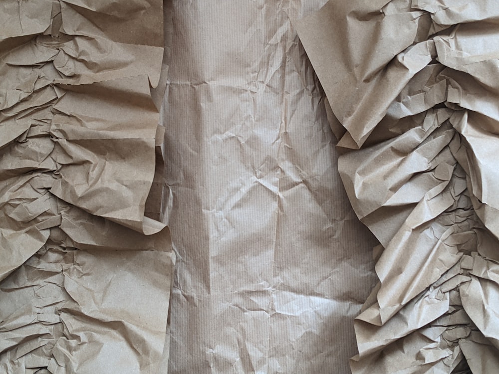brown paper on white textile