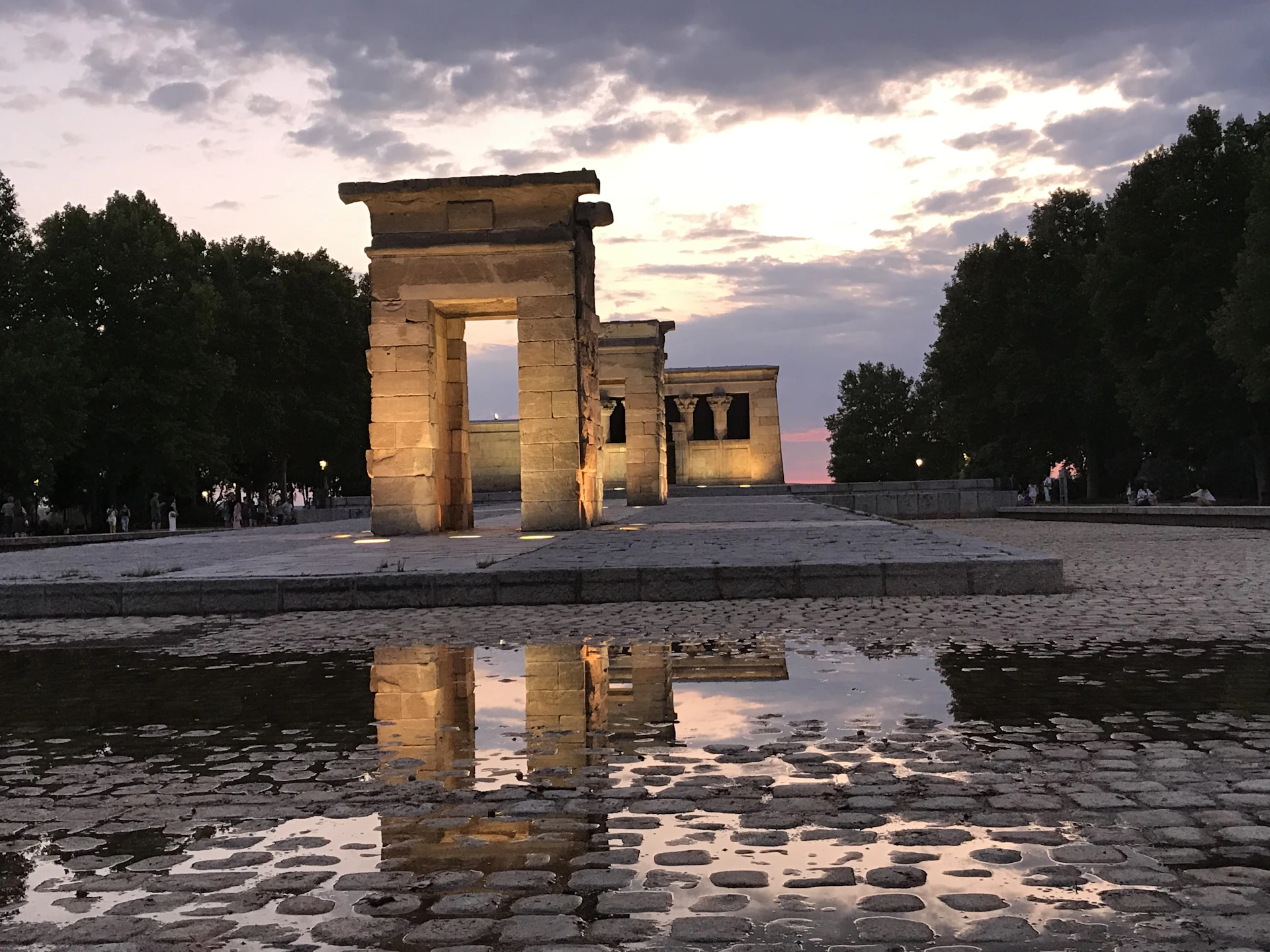 woman wearing yellow long-sleeved dress under white clouds and blue sky during daytime