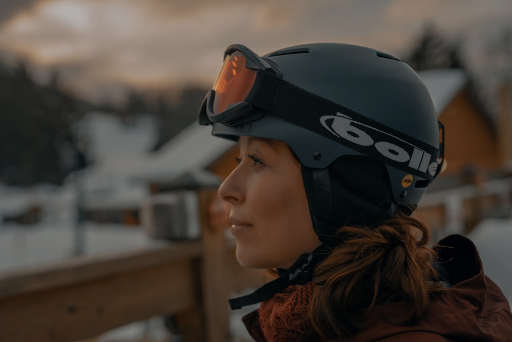 man in black helmet and orange jacket