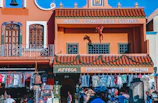 A vibrant storefront of Fomy Fiesta in the heart of Puebla bustling with customers.