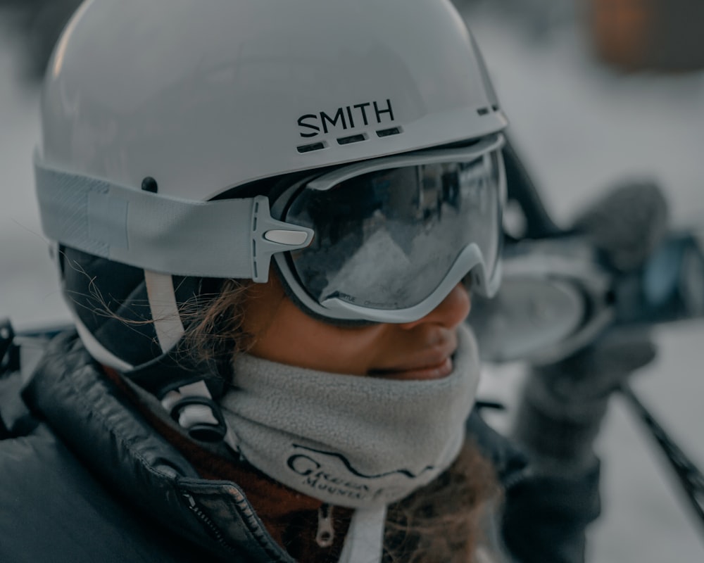 person wearing white helmet and black jacket