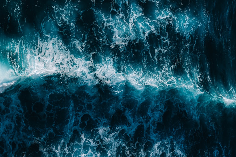 blue water waves during daytime