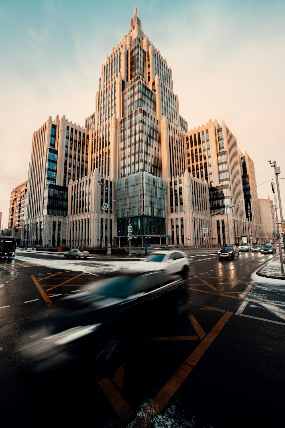 cars on road near high rise buildings during daytime