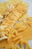 yellow pasta on white paper