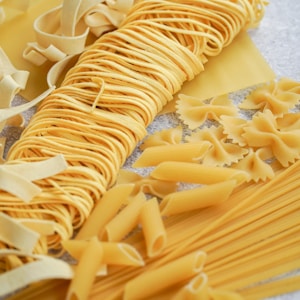yellow pasta on white paper