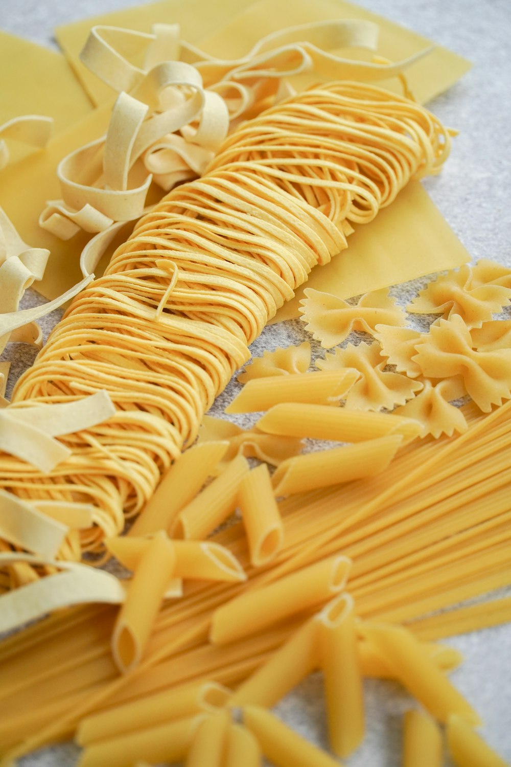 yellow pasta on white paper