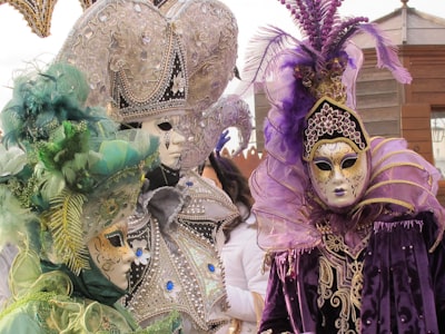 woman in purple and gold dress with gold crown mardi gras zoom background