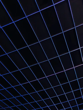 Minimalist digital grid with subtle deep blue accents representing structured social media planning.