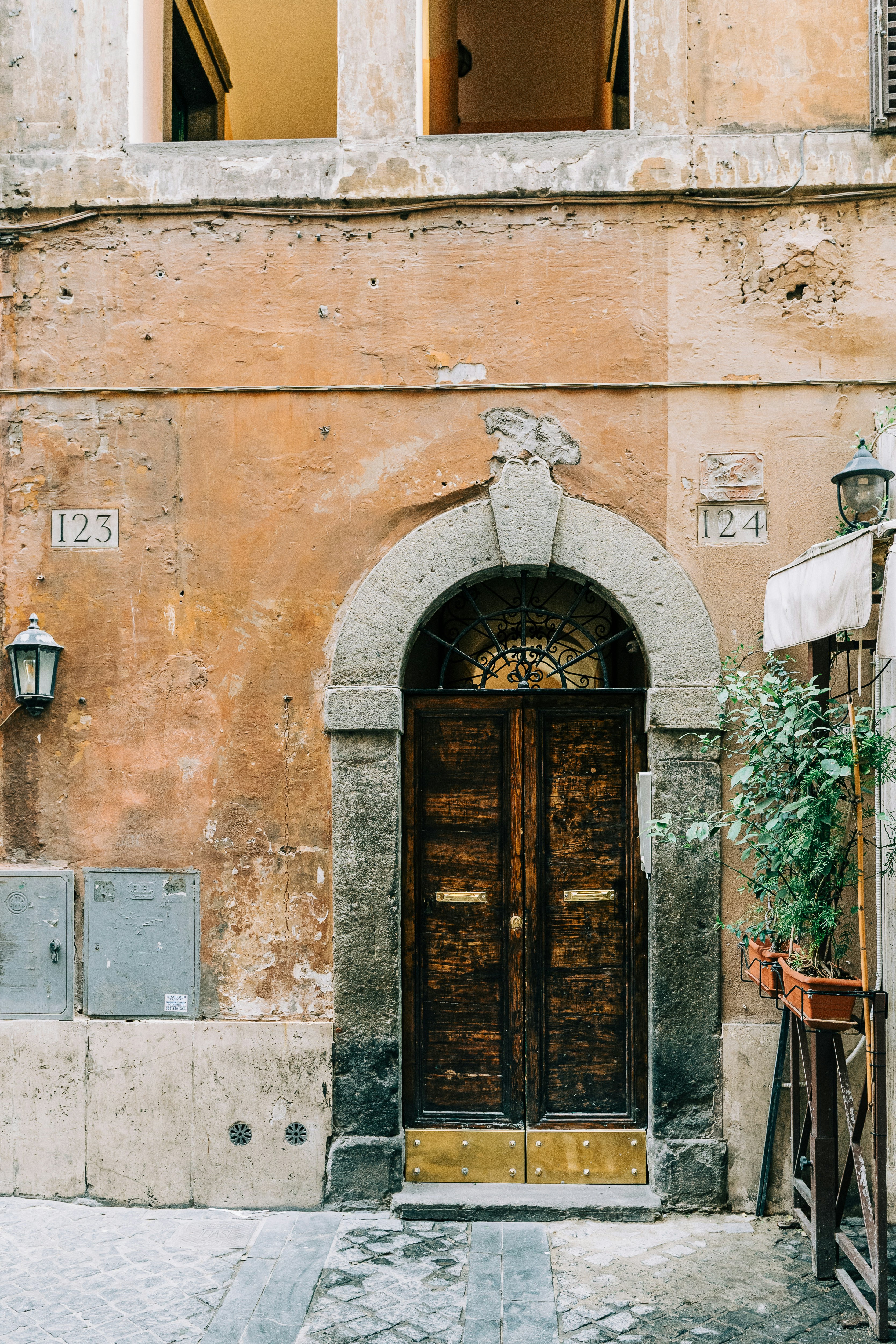 brown wooden door on brown concrete building