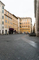 A charming street scene in the Italian area of Novara with historic buildings and vibrant local life.
