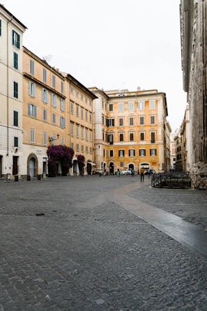 A charming street scene in the Italian area of Novara with historic buildings and vibrant local life.