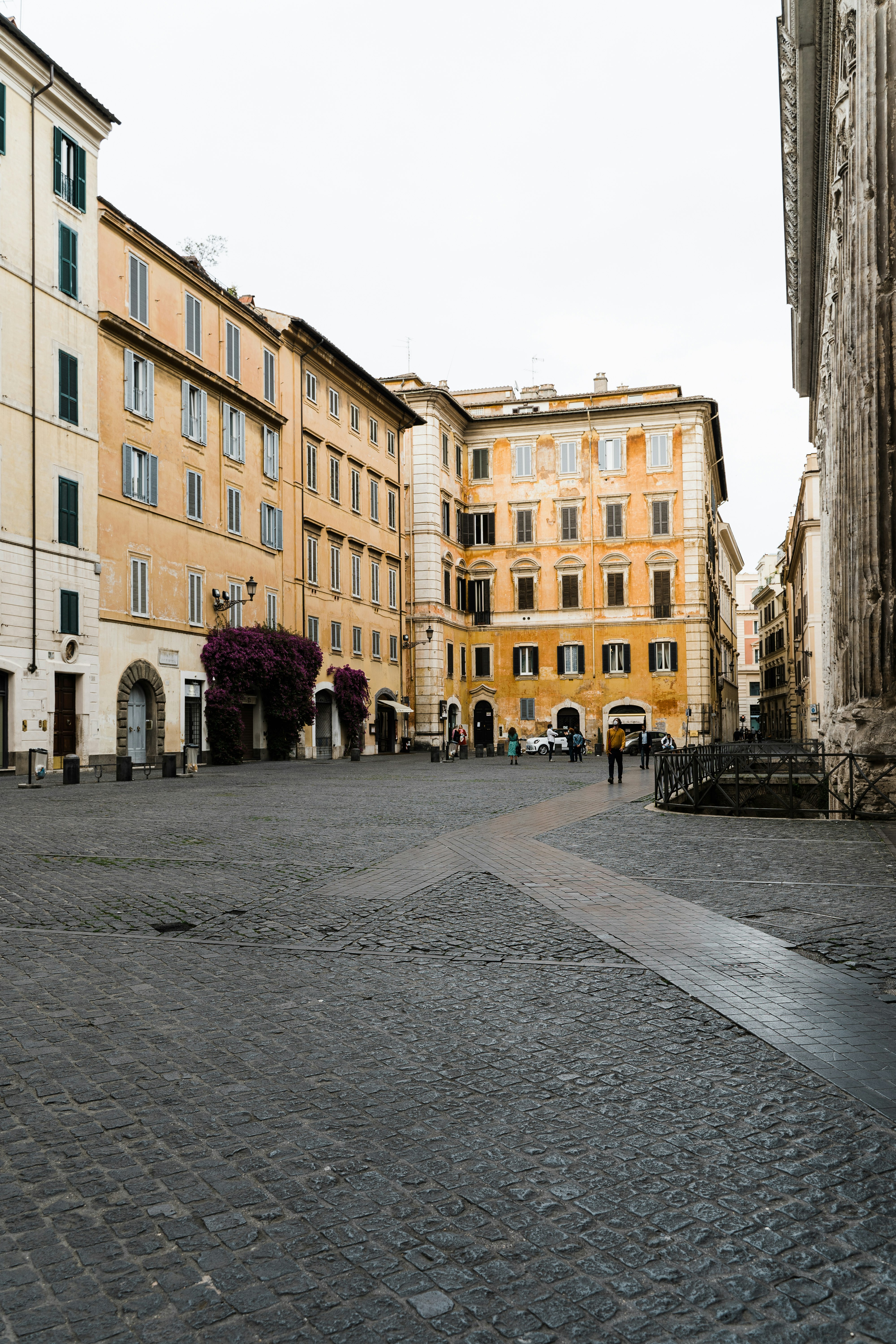 people walking on street near buildings during daytime