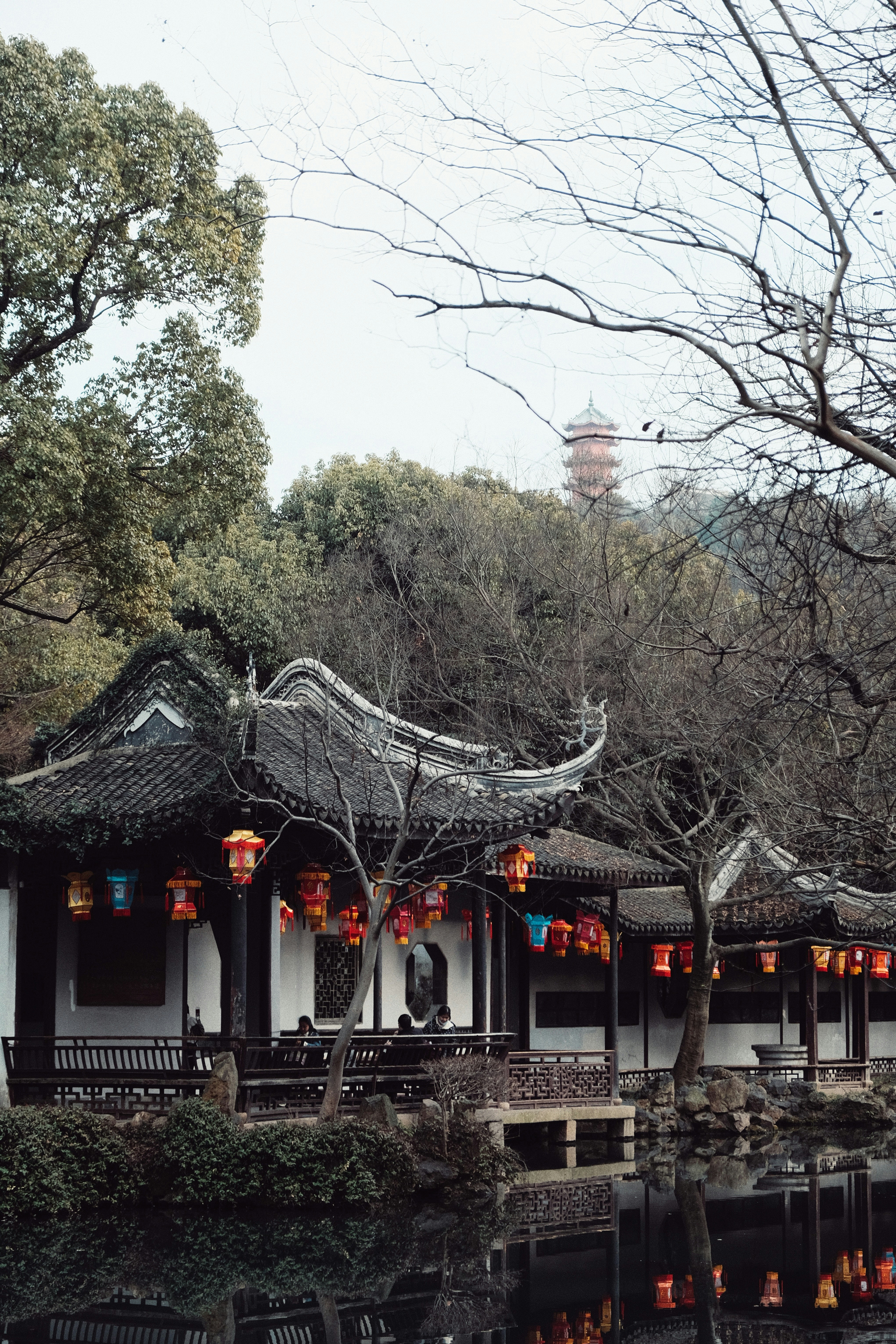 brown and white concrete building near trees during daytime
