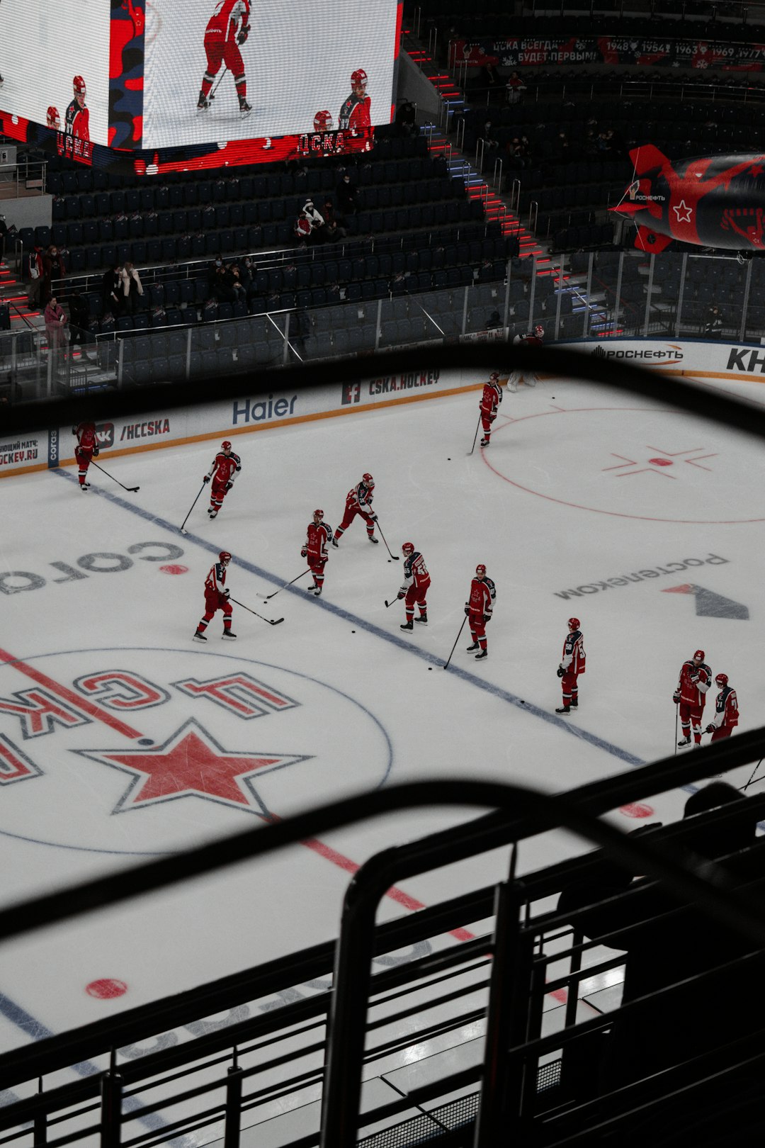 people playing ice hockey on stadium