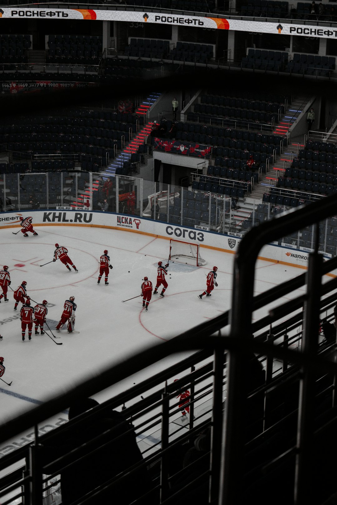 people playing ice hockey on ice stadium