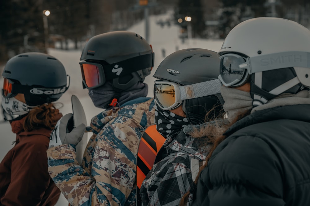 2 men in black and white jacket wearing helmet during daytime