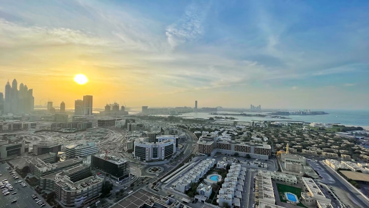 A panoramic view of the Inar Building and surrounding office towers in Metro Cebu at sunset.